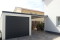 Einzelgarage mit Sektionaltor und Anbau-Carport - BRANDL
