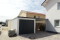 Einzelgarage mit Sektionaltor und Anbau-Carport - BRANDL